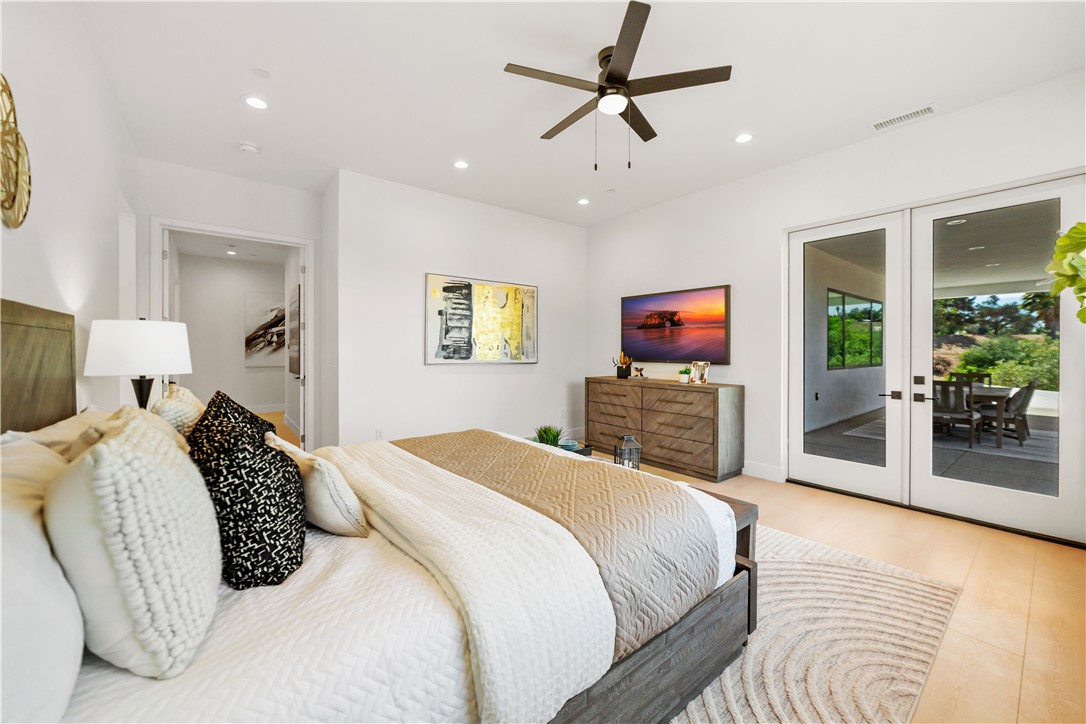 2027 Vía Monserate Fallbrook, CA 92028 - Photo 10 of 66 a bedroom with a bed and a flat screen tv