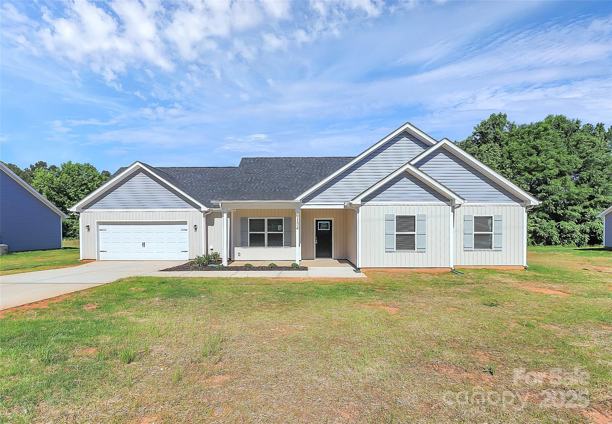 6154 Lowder Road Salisbury, NC 28147 - Photo 1 of 36 a front view of a house with a yard and trees