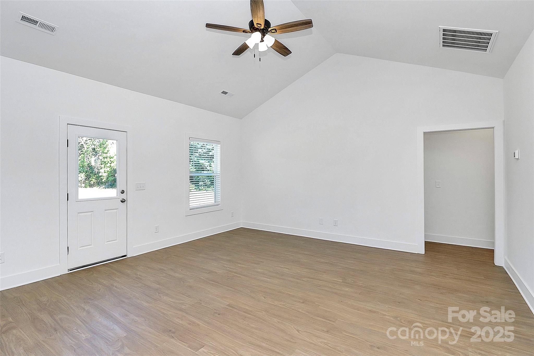 6154 Lowder Road Salisbury, NC 28147 - Photo 13 of 36 an empty room with a window and a ceiling fan