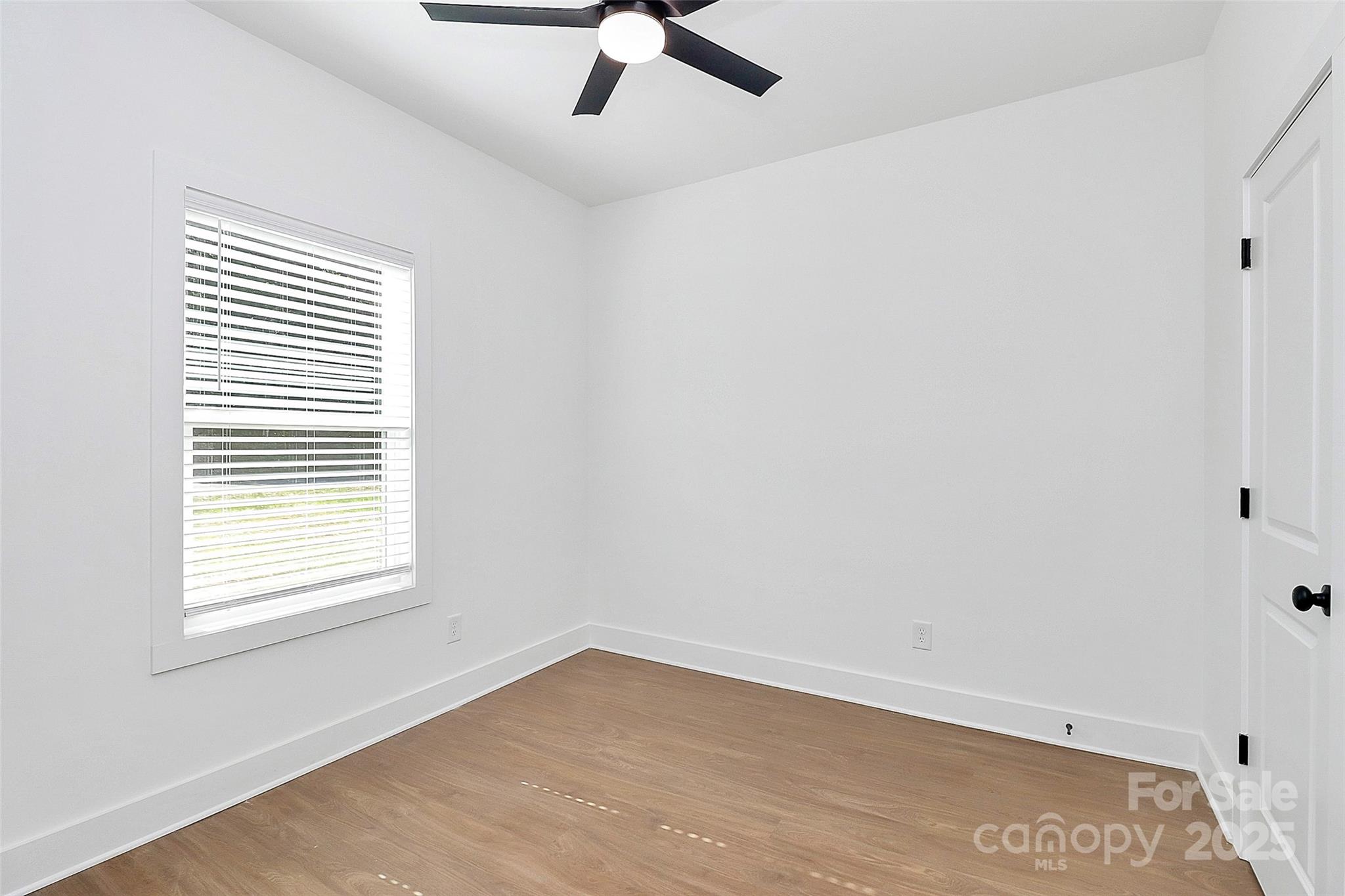 6154 Lowder Road Salisbury, NC 28147 - Photo 15 of 36 an empty room with a window and a ceiling fan
