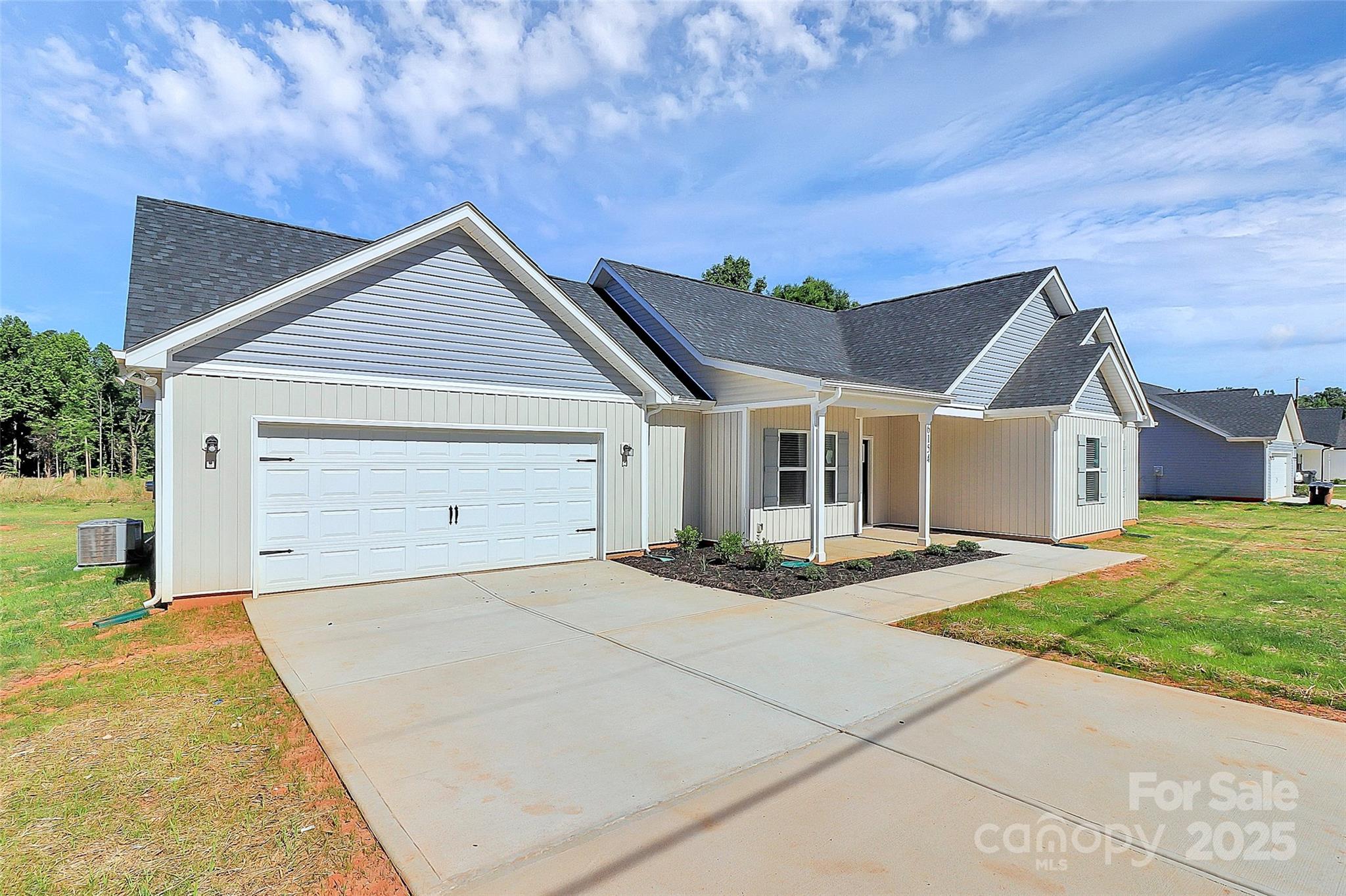 6154 Lowder Road Salisbury, NC 28147 - Photo 2 of 36 a view of yellow house with a yard and large tree