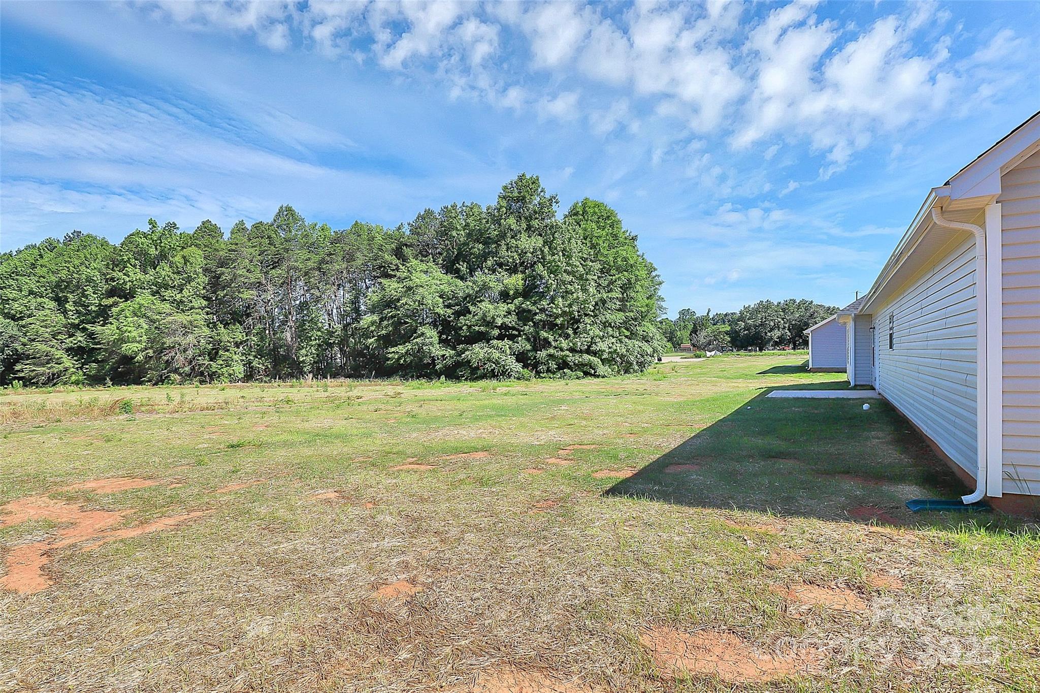 6154 Lowder Road Salisbury, NC 28147 - Photo 27 of 36 a backyard of a house with lots of green space
