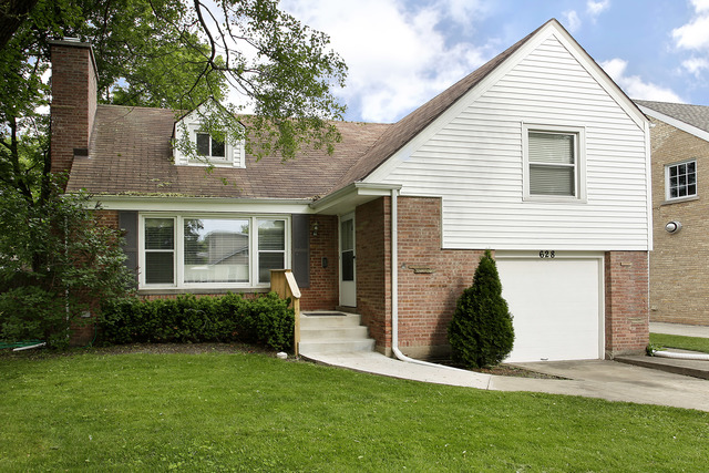 628 Exmoor Road Kenilworth, IL 60043 - Photo 1 of 1 a view of a house with a yard and plants
