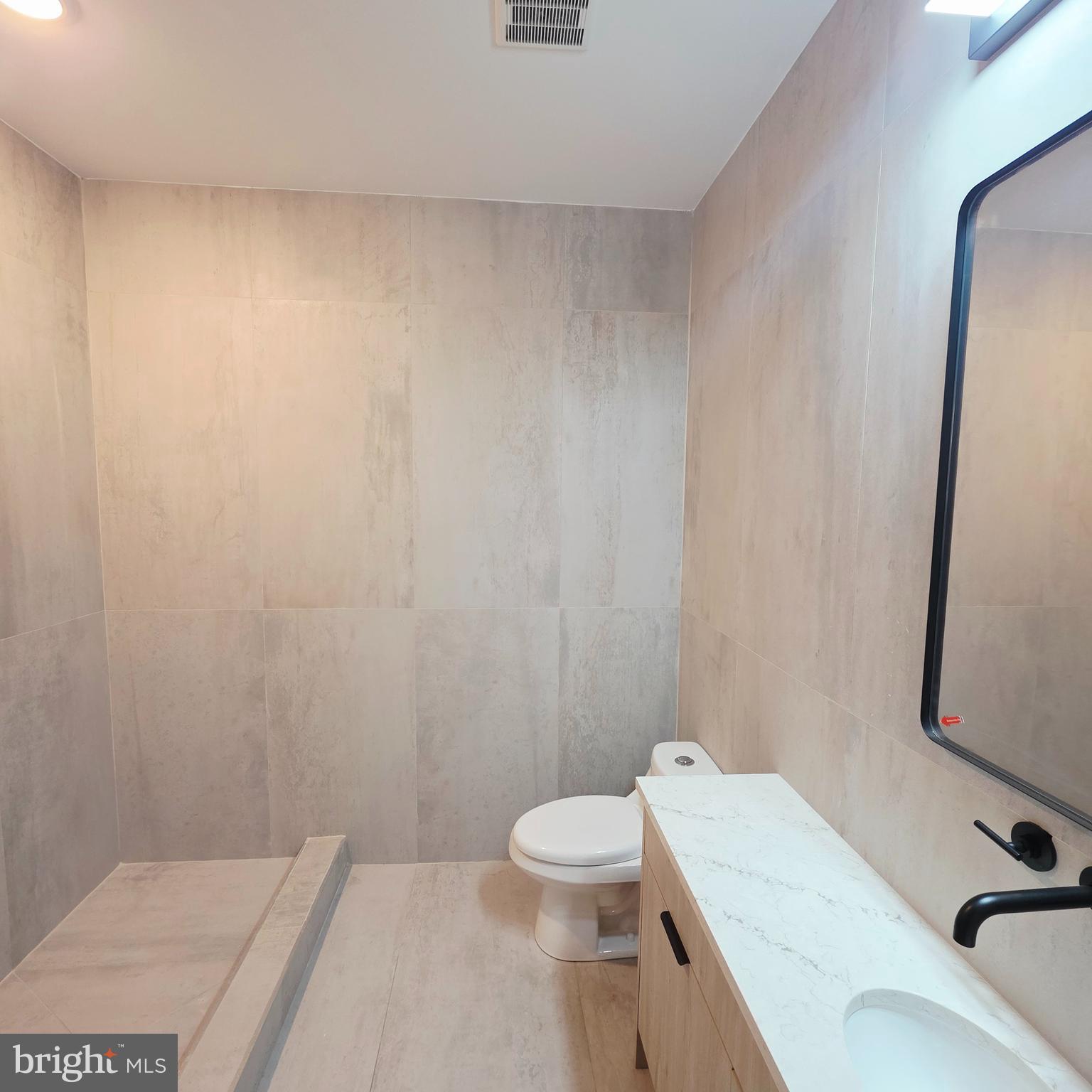 714 Chestnut Street, Unit 3F Philadelphia, PA 19106 - Photo 12 of 16 a bathroom with a sink and a toilet