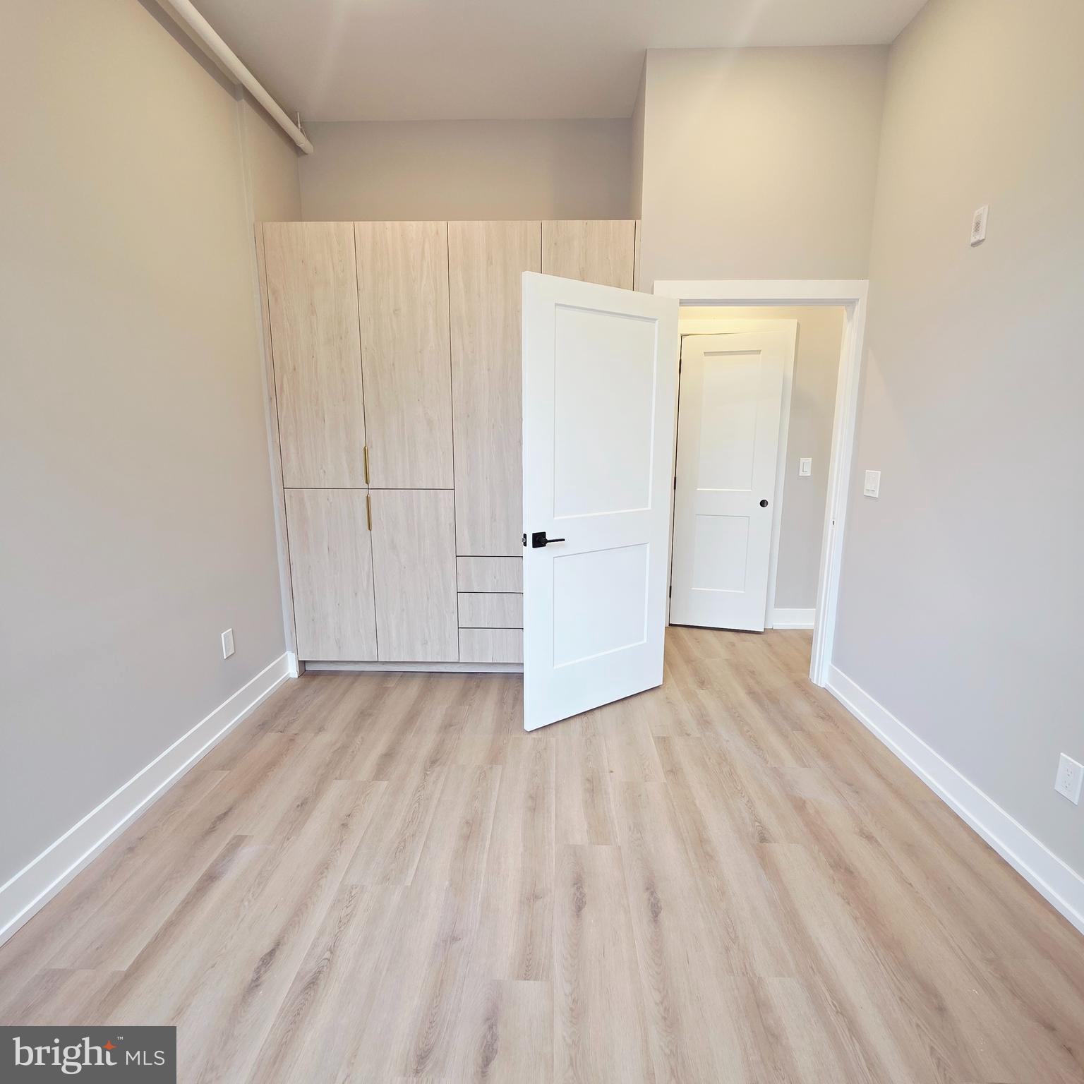 714 Chestnut Street, Unit 3F Philadelphia, PA 19106 - Photo 14 of 16 a view of a room with wooden floor