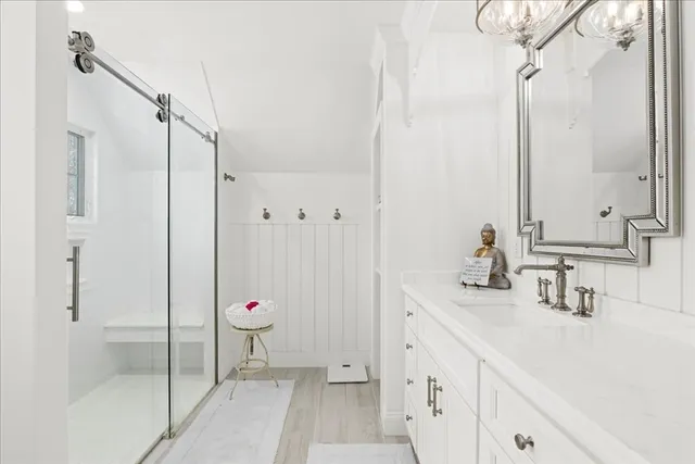 a bathroom with a double vanity sink mirror and double