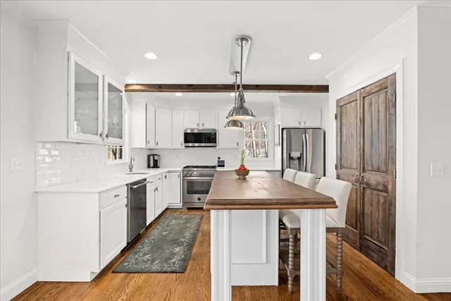 a kitchen with sink cabinets and window