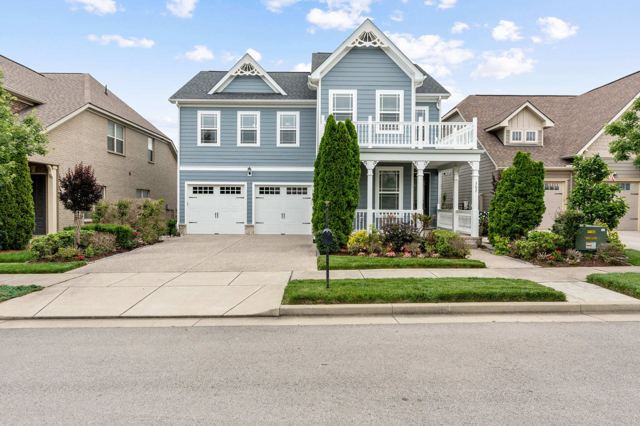 307 Rafferty Court Franklin, TN 37064 - Photo 2 of 55 a front view of a house with a yard and potted plants