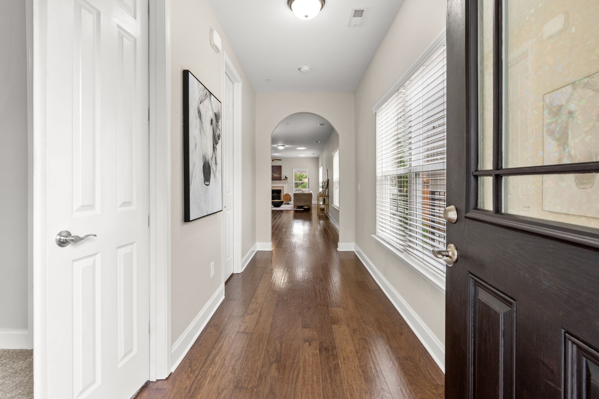 307 Rafferty Court Franklin, TN 37064 - Photo 8 of 55 a view of a hallway with wooden floor and staircase