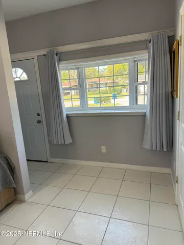 a view of a livingroom with a large window