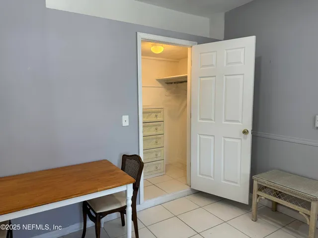 a view of a room with table and chair