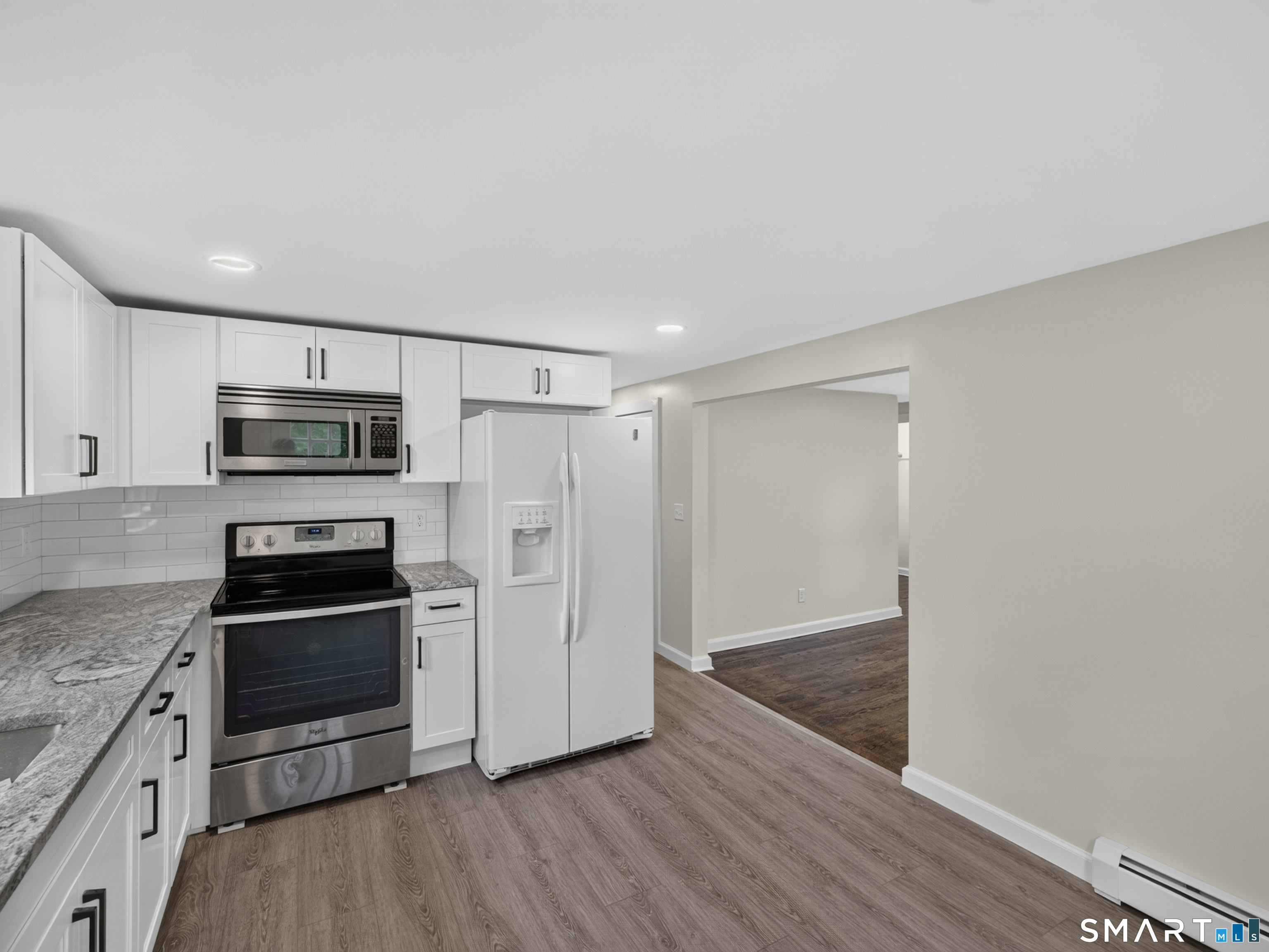 1039 N Road Groton, CT 06340 - Photo 10 of 26 a kitchen with granite countertop a refrigerator and a sink