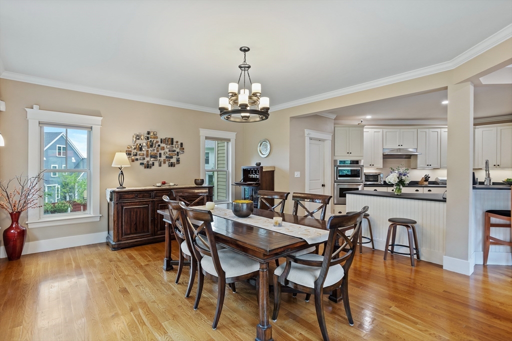 5 Walnut Street Lexington, MA 02421 - Photo 7 of 34 a view of a dining room with furniture and wooden floor