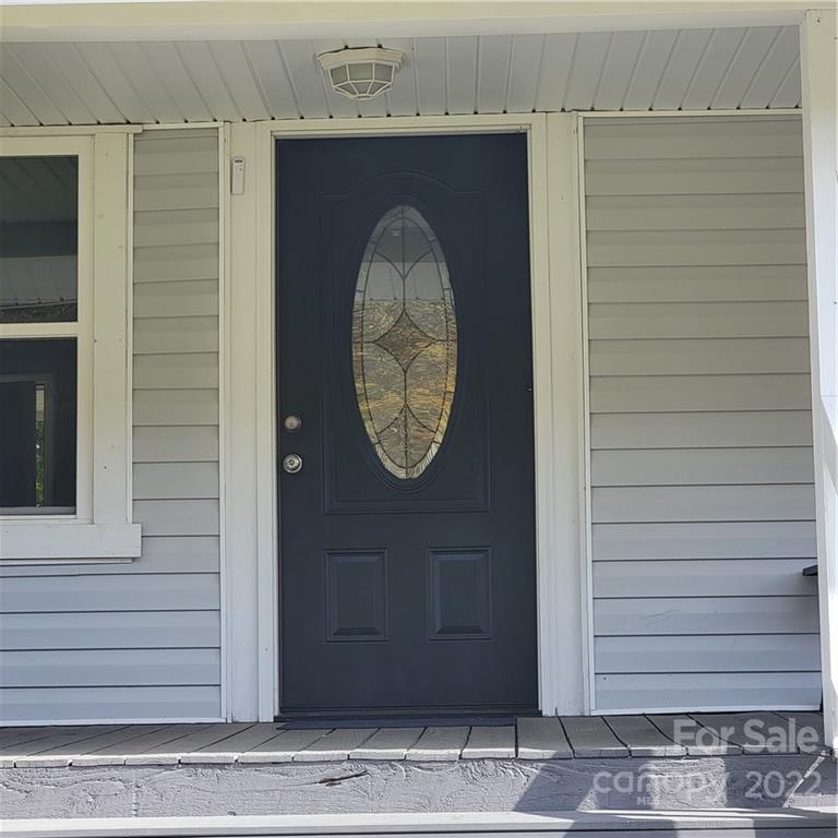 26 Possum Trot Road Bakersville, NC 28705 - Photo 7 of 22 a front view of a house