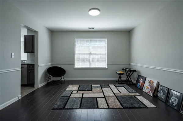 a kitchen with a black white checkered floor stove and a refrigerator