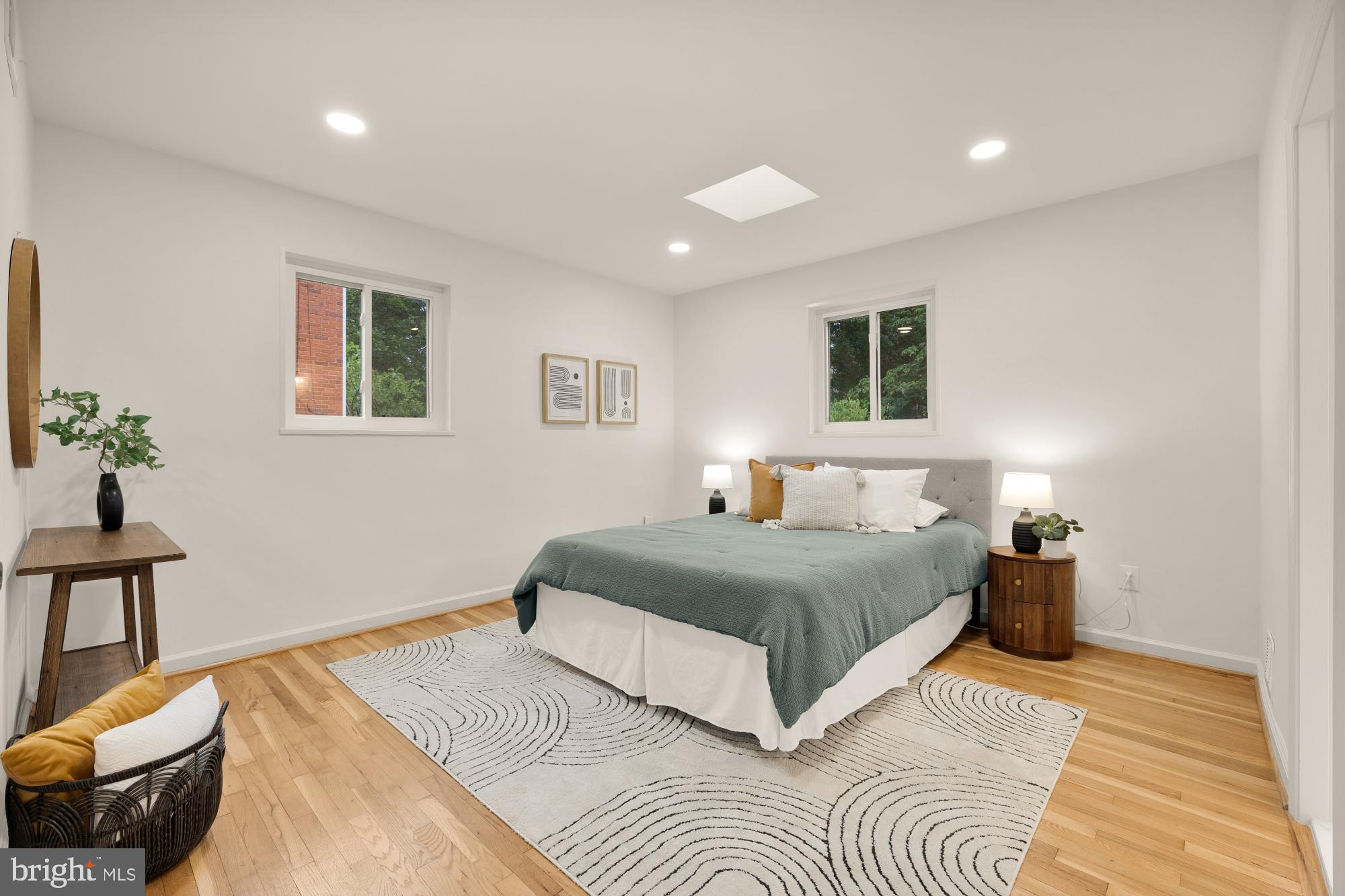 6232 18th Road North Arlington, VA 22205 - Photo 17 of 43 a bedroom with a large bed and a chandelier