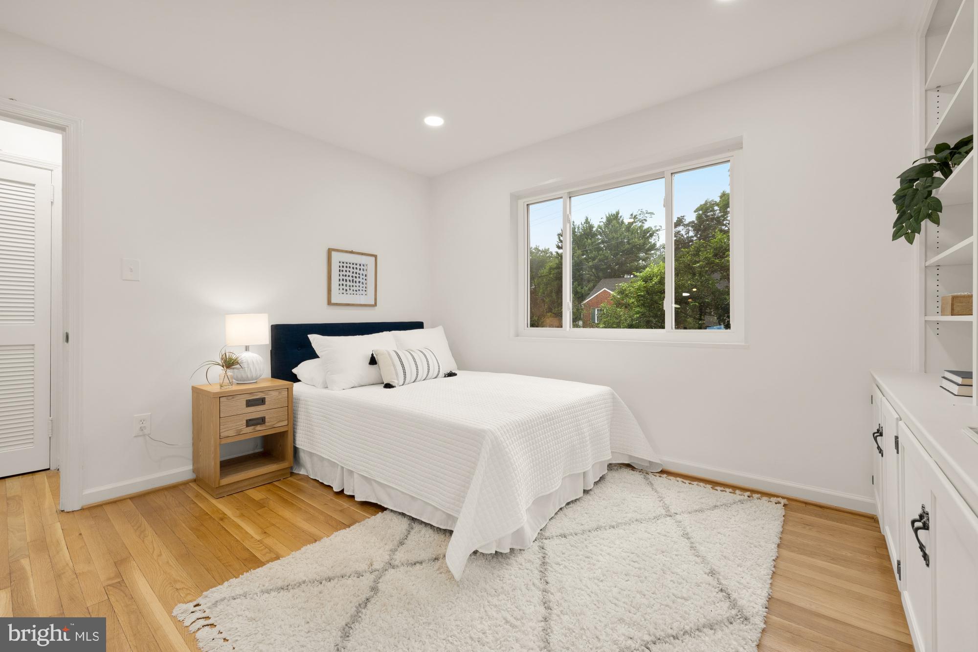 6232 18th Road North Arlington, VA 22205 - Photo 24 of 43 a large white bed in a white room