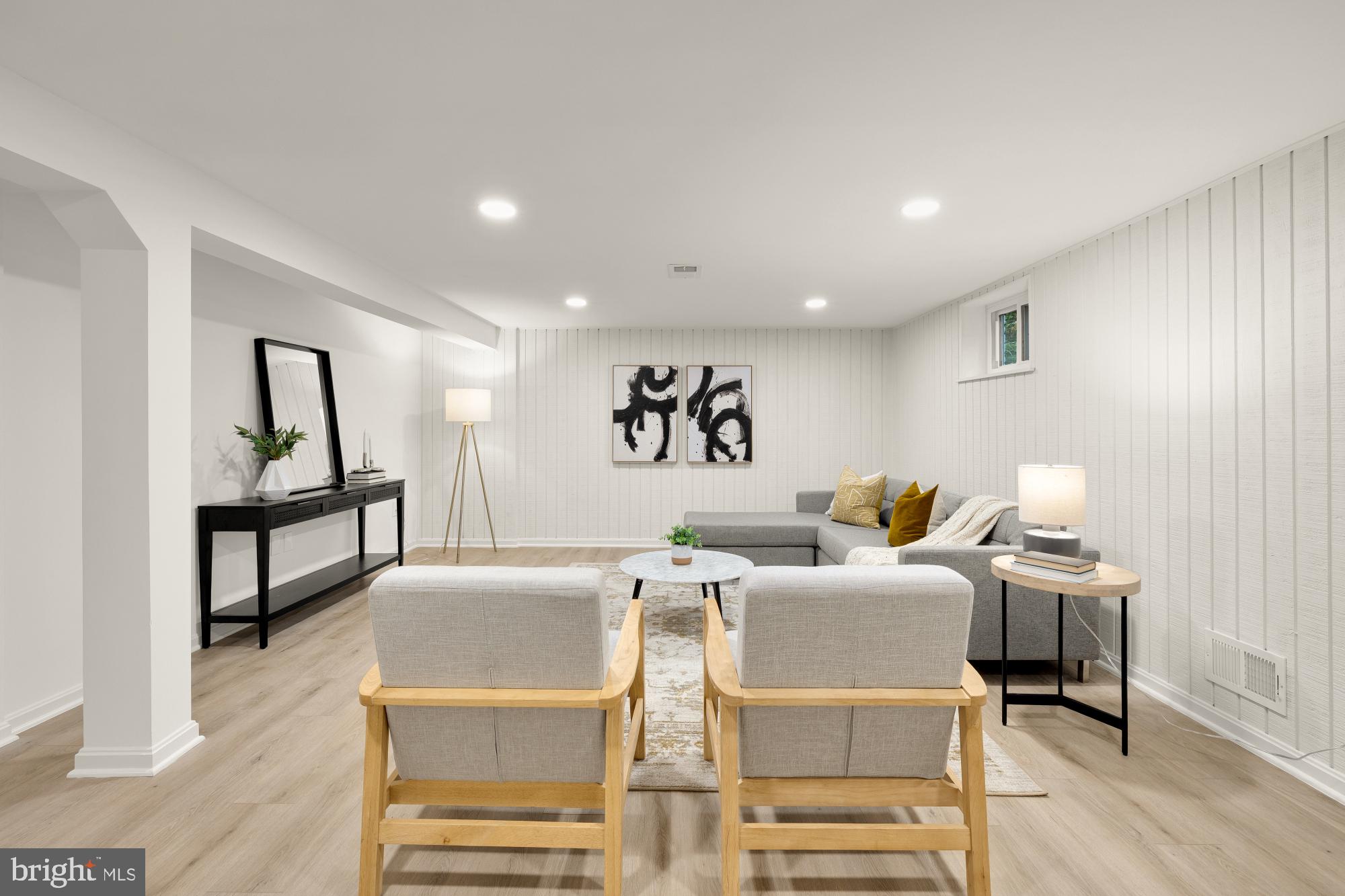 6232 18th Road North Arlington, VA 22205 - Photo 29 of 43 a living room with couches and kitchen view with wooden floor