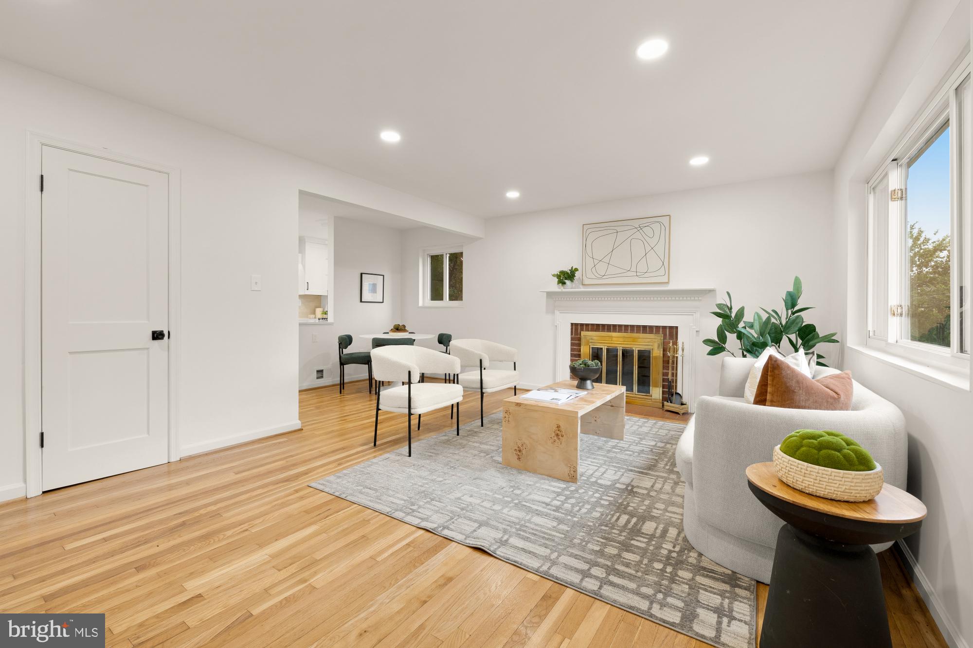 6232 18th Road North Arlington, VA 22205 - Photo 3 of 43 a living room with furniture a fireplace and a table