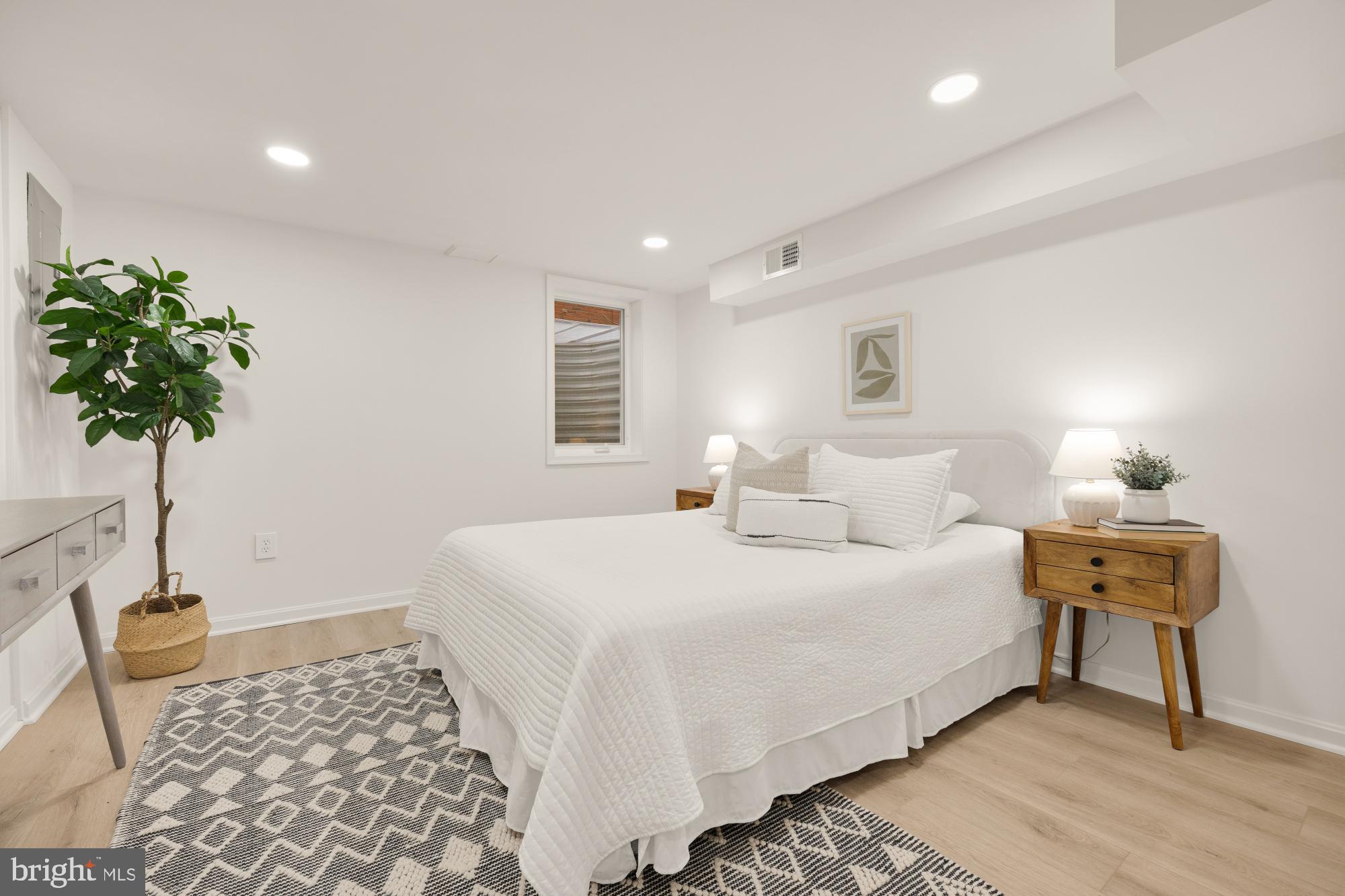 6232 18th Road North Arlington, VA 22205 - Photo 34 of 43 a bedroom with a bed and a potted plant