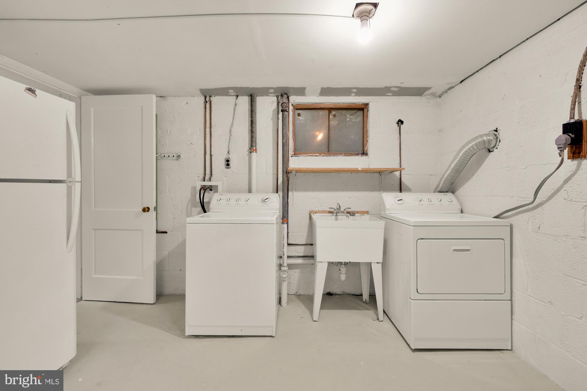 6232 18th Road North Arlington, VA 22205 - Photo 37 of 43 a utility room with cabinets washer and dryer