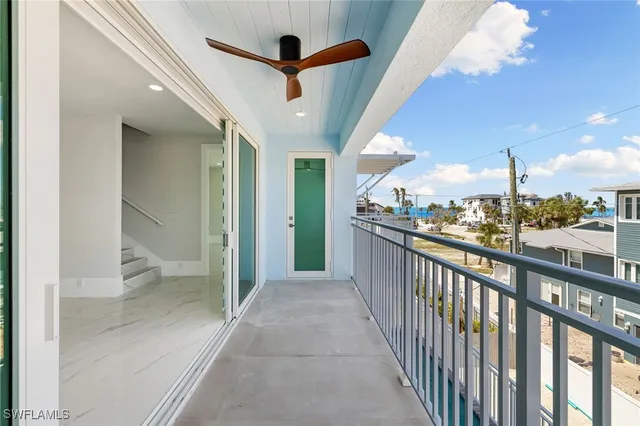 a kitchen that has a sink a refrigerator and a stove