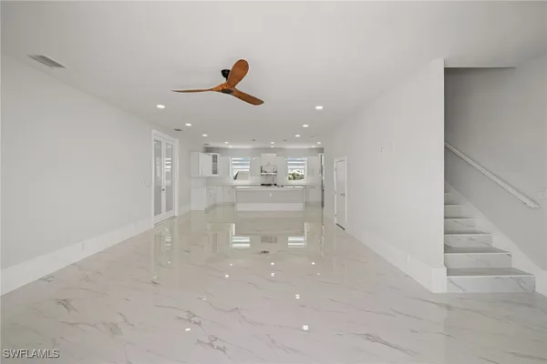 a kitchen with stainless steel appliances a stove sink microwave and refrigerator