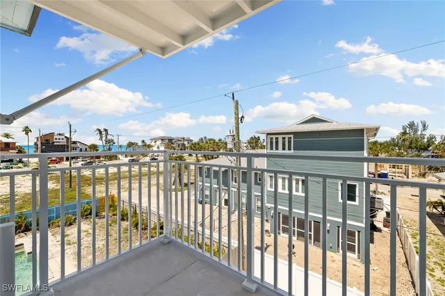a kitchen with stainless steel appliances kitchen island granite countertop a refrigerator and a sink