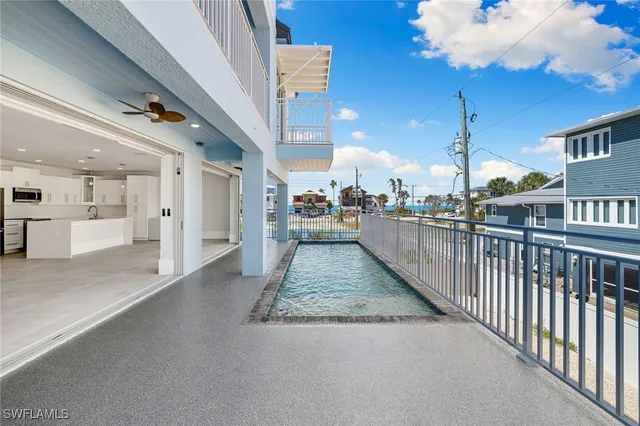 a view of a hallway with chandelier