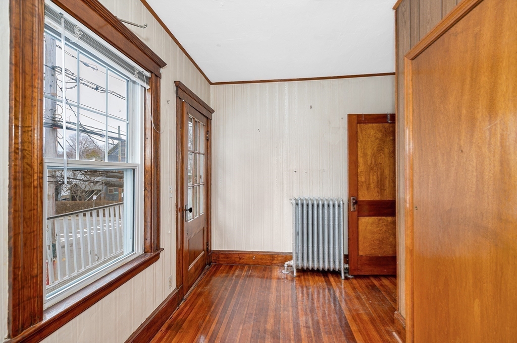 481 Lagrange Street Boston, MA 02132 - Photo 11 of 32 a view of a room with wooden floor and a window