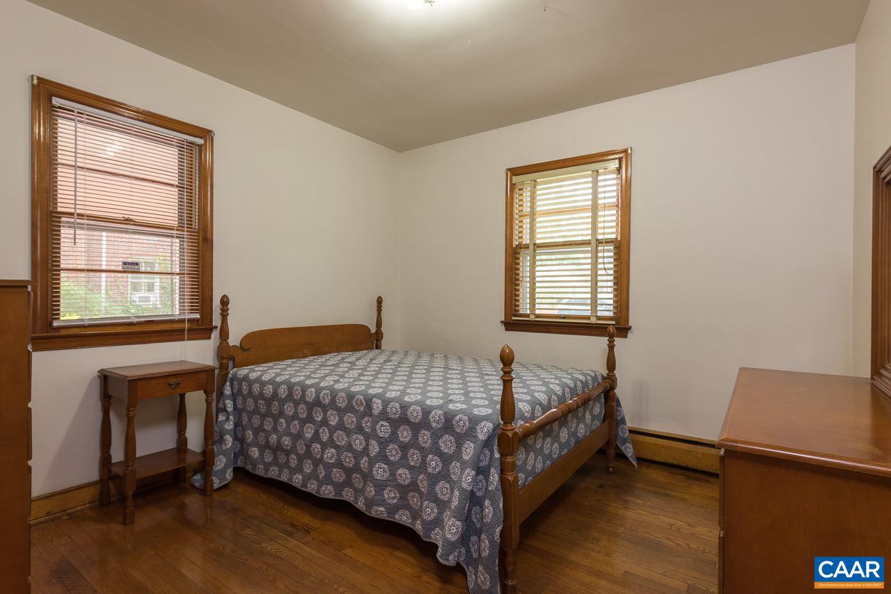 516 Ridge Street Charlottesville, VA 22902 - Photo 9 of 13 a bedroom with a bed and window