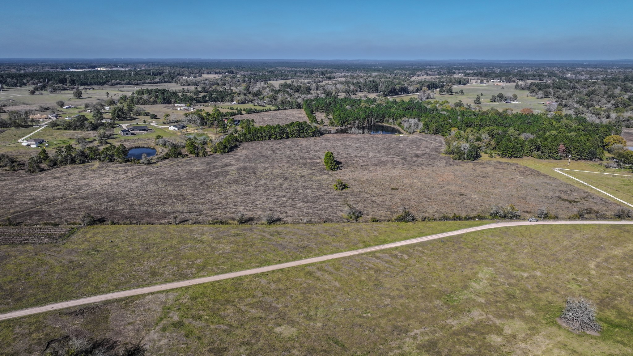 Tbd Lot 2 Tbd Road New Waverly, TX 77358 - Photo 17 of 24 an aerial view of a houses with a yard