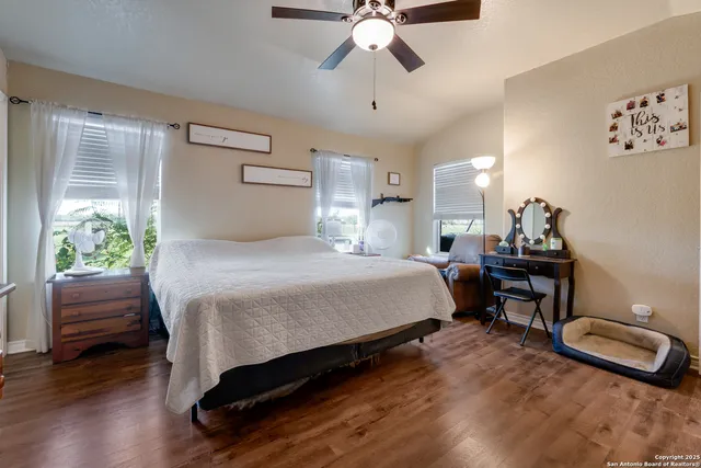 a bedroom with a bed and a chair