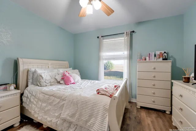 a bedroom with a bed and a dresser