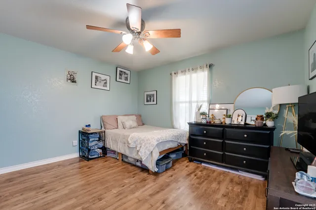 a bed room with a bed window and a lamp