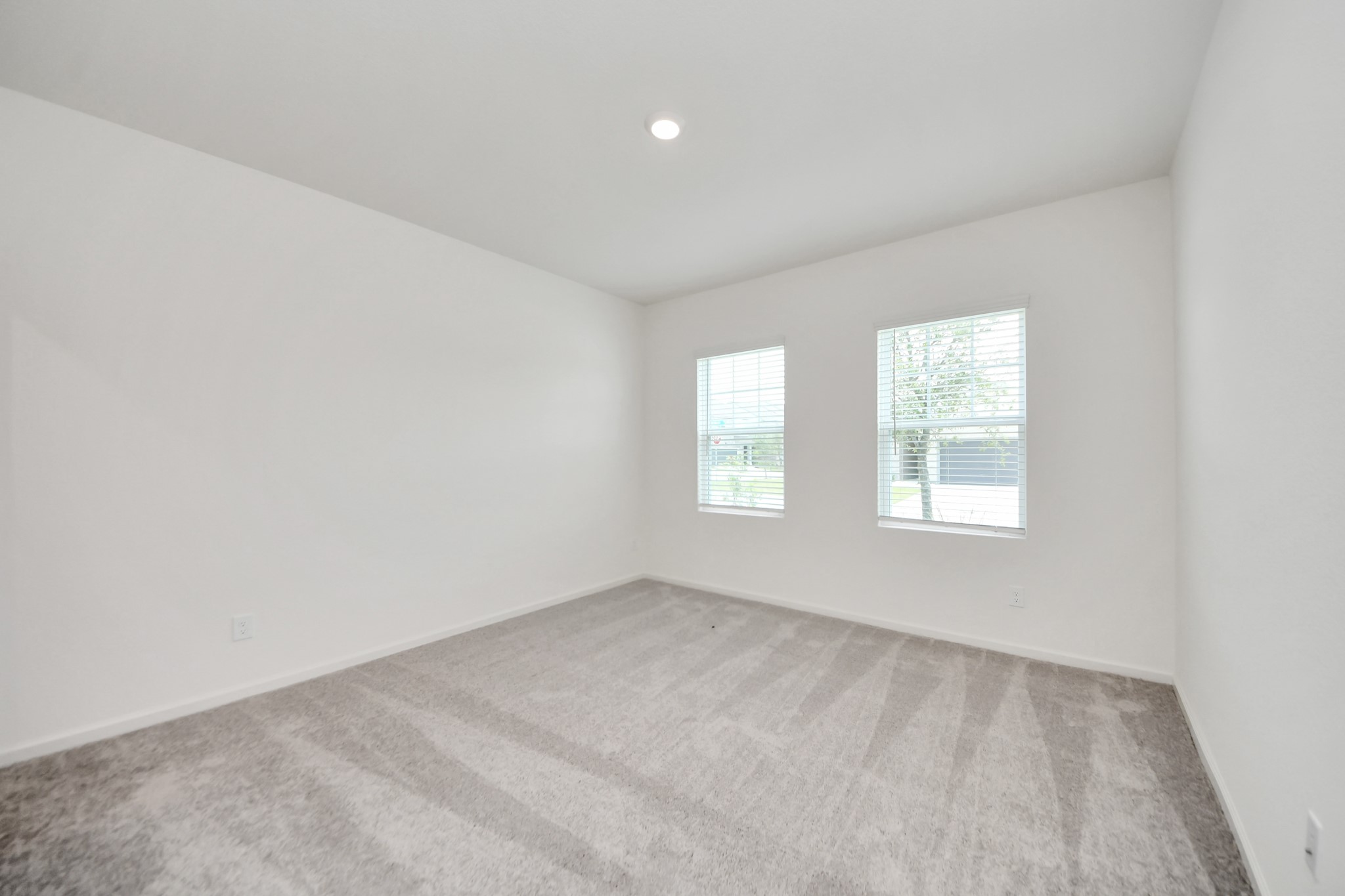 10307 Costa Ter Drive Rosharon, TX 77583 - Photo 15 of 49 an empty room with windows