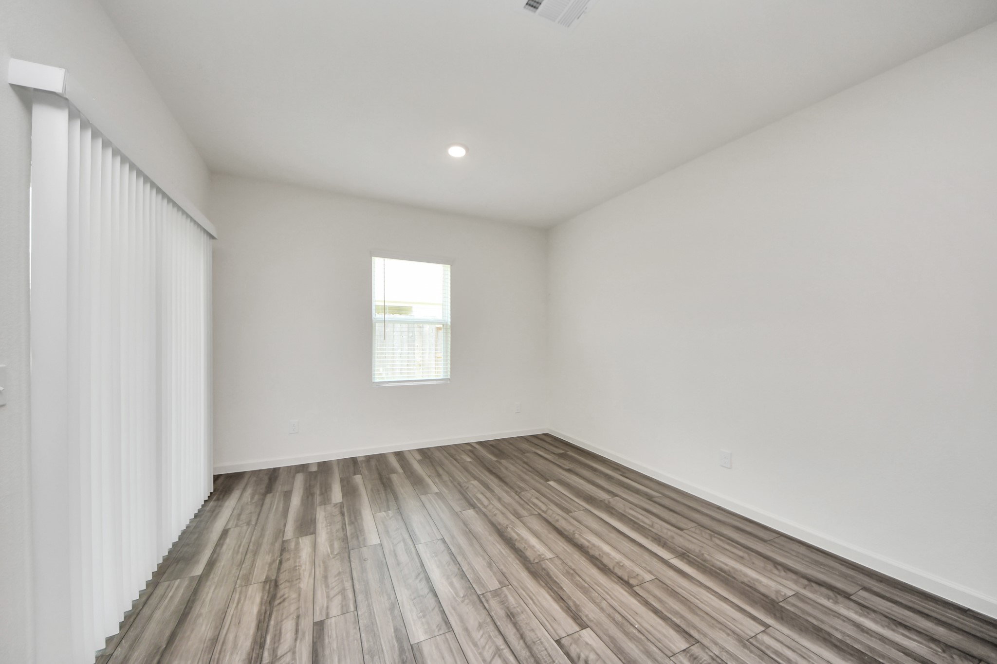 10307 Costa Ter Drive Rosharon, TX 77583 - Photo 25 of 49 a view of empty room with wooden floor