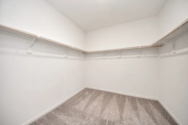 a view of a room with shelf on the wall