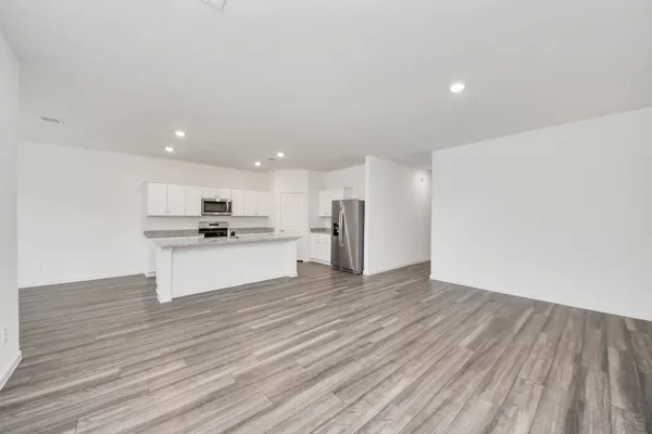 a view of kitchen with granite countertop a stove top oven