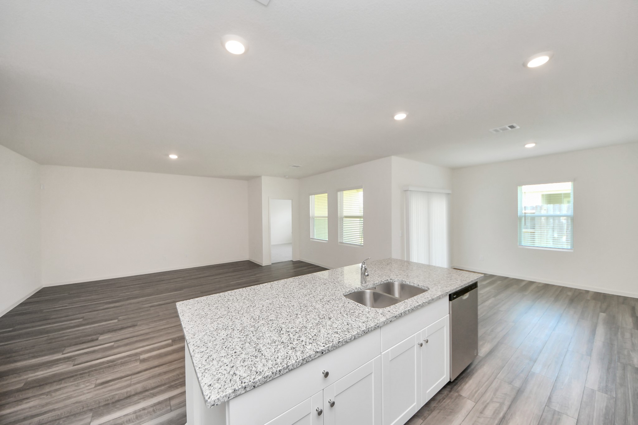 10307 Costa Ter Drive Rosharon, TX 77583 - Photo 9 of 49 a kitchen with a sink and wooden floor