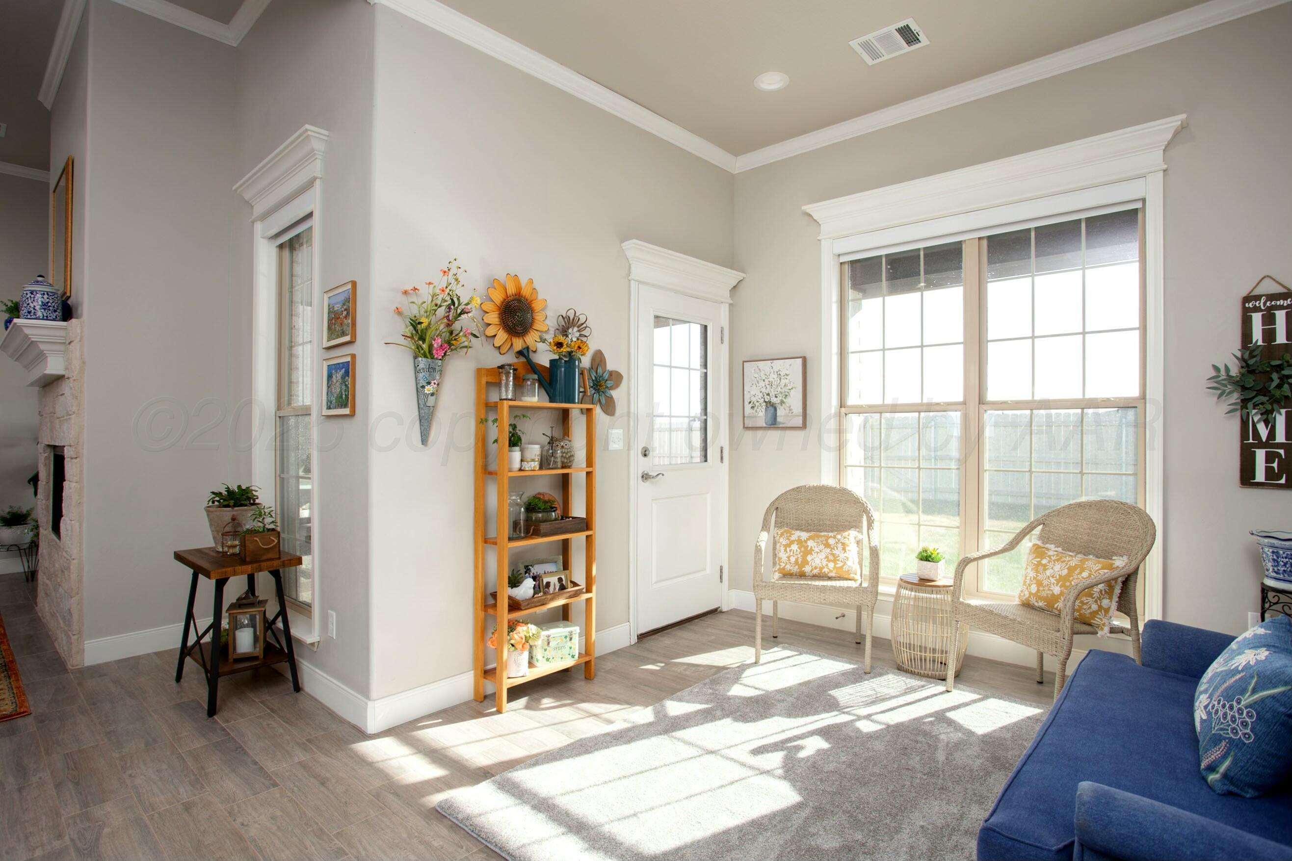18501 Helium Road Canyon, TX 79015 - Photo 13 of 28 a living room with furniture and a window
