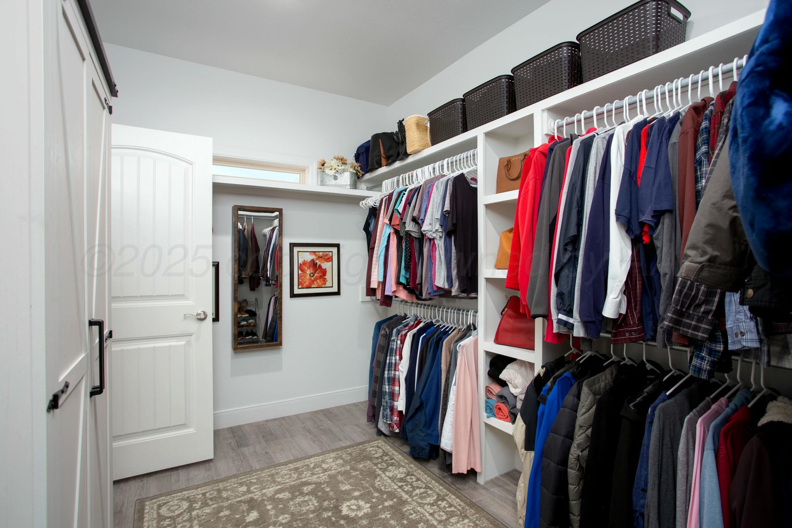 18501 Helium Road Canyon, TX 79015 - Photo 19 of 28 a view of walk in closet with clothes and shoes
