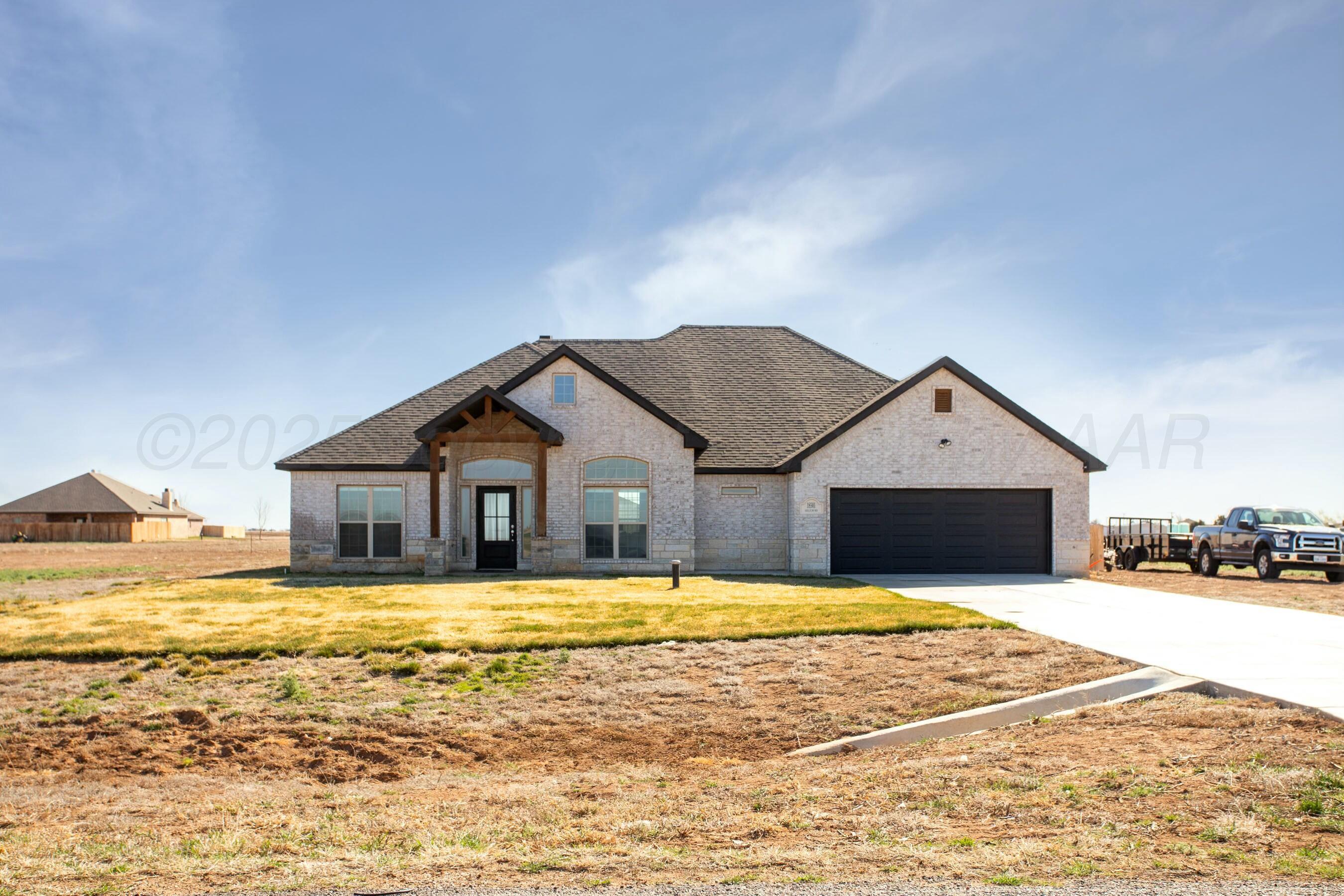 18501 Helium Road Canyon, TX 79015 - Photo 2 of 28 a view of a house with a swimming pool
