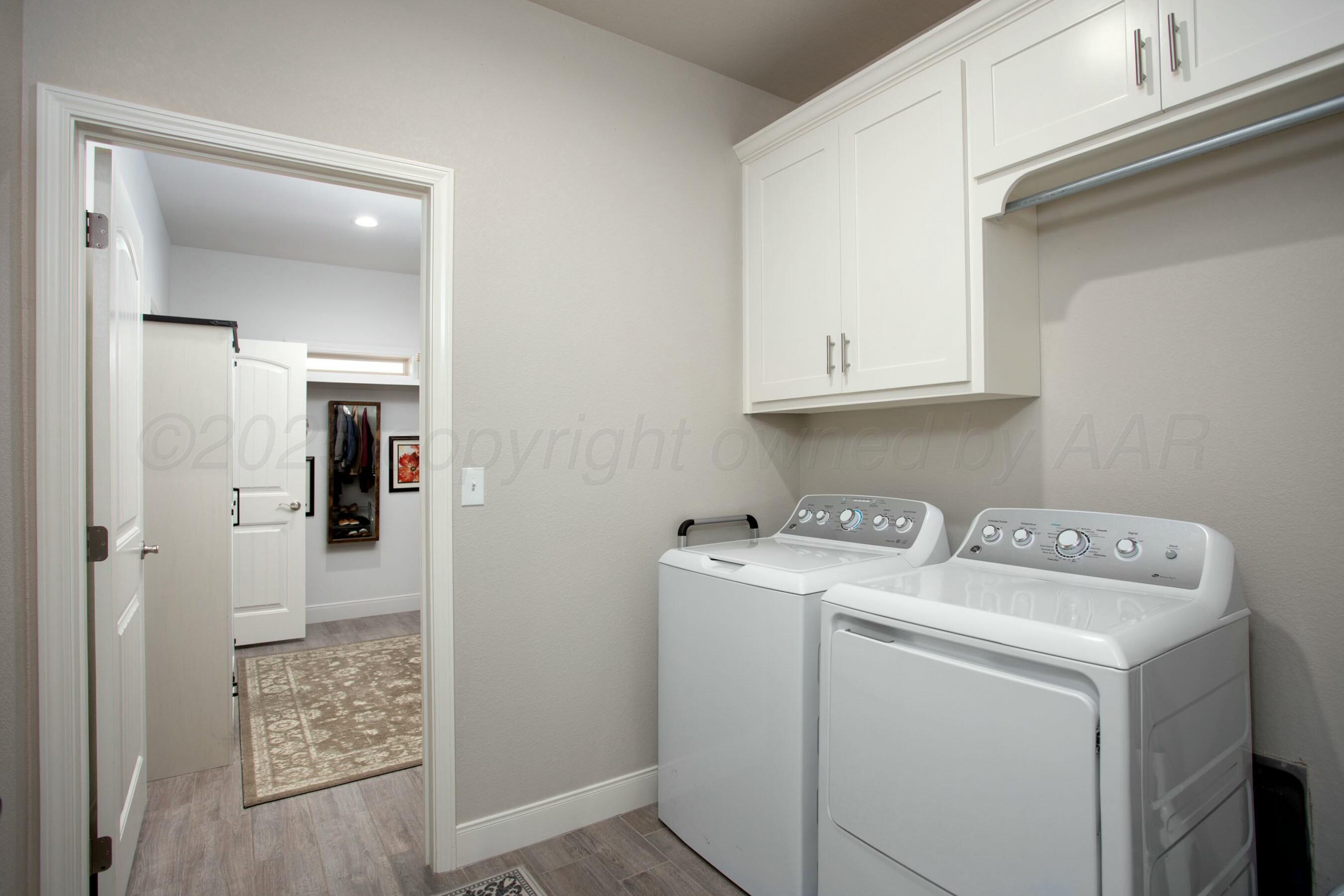 18501 Helium Road Canyon, TX 79015 - Photo 24 of 28 a utility room with dryer and washer