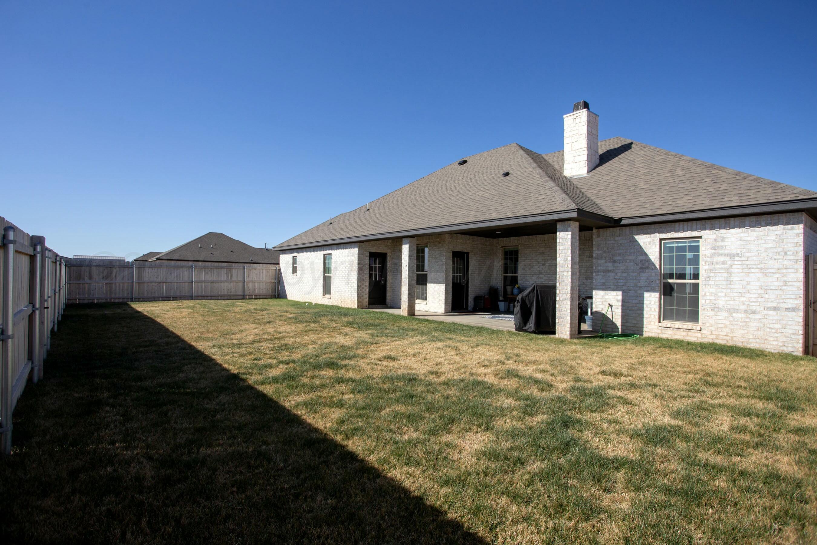 18501 Helium Road Canyon, TX 79015 - Photo 28 of 28 a front view of a house with a garden