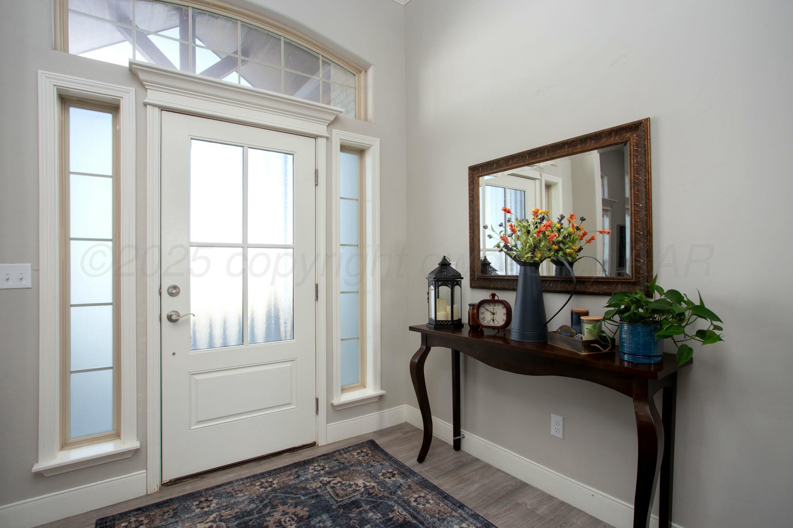 18501 Helium Road Canyon, TX 79015 - Photo 3 of 28 a dining room with furniture and flowers
