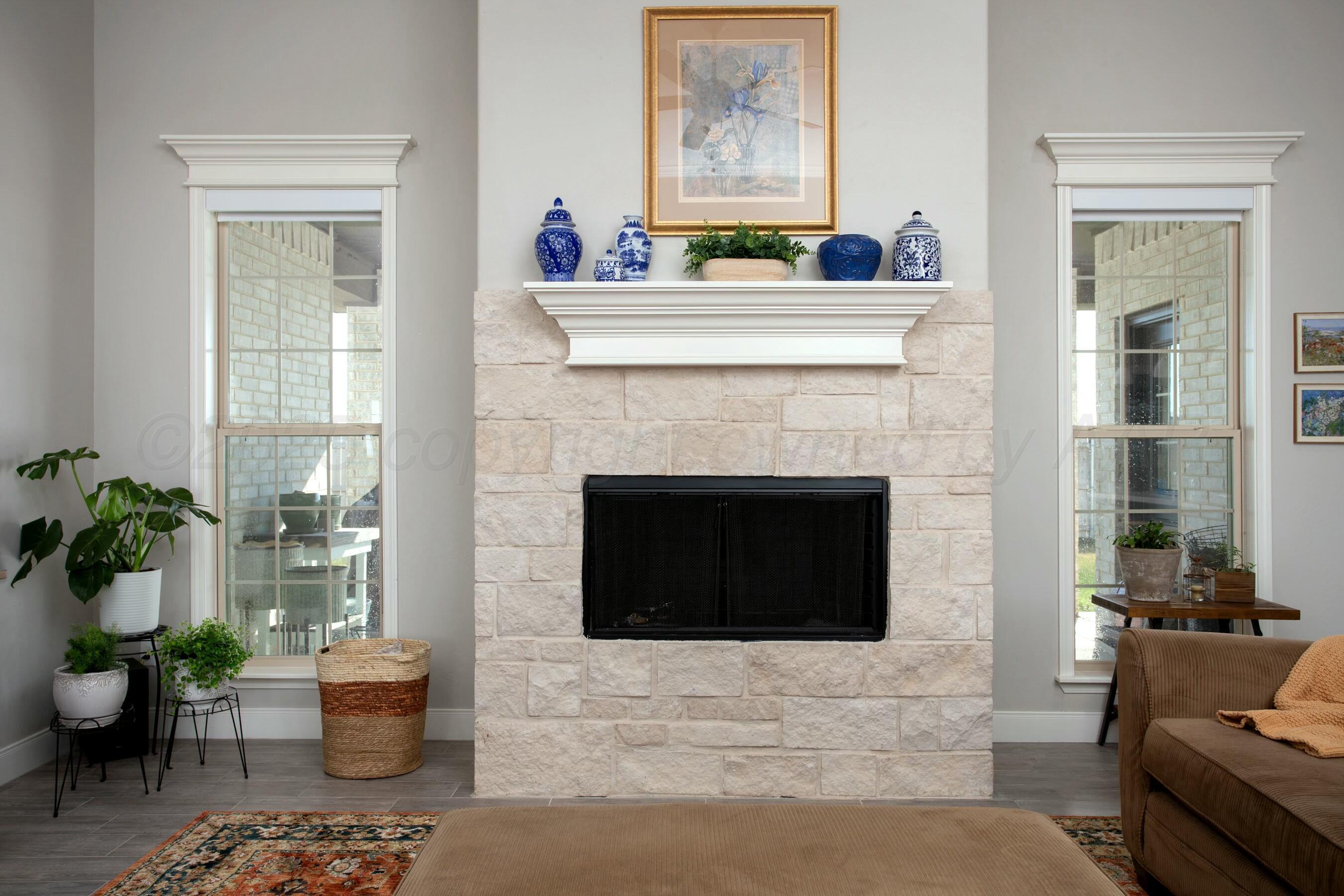 18501 Helium Road Canyon, TX 79015 - Photo 6 of 28 a living room with furniture and a fireplace