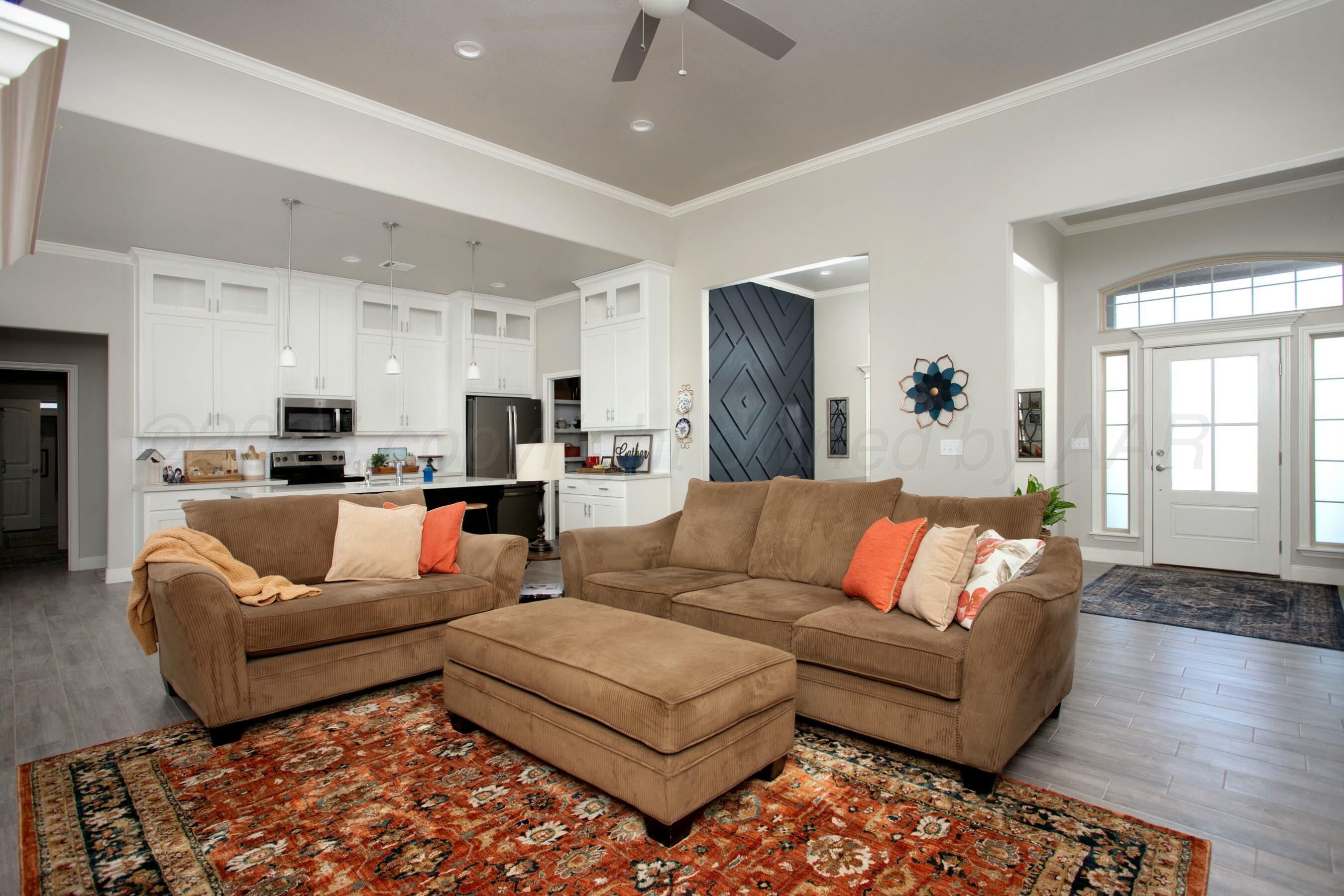 18501 Helium Road Canyon, TX 79015 - Photo 7 of 28 a living room with furniture and a couch