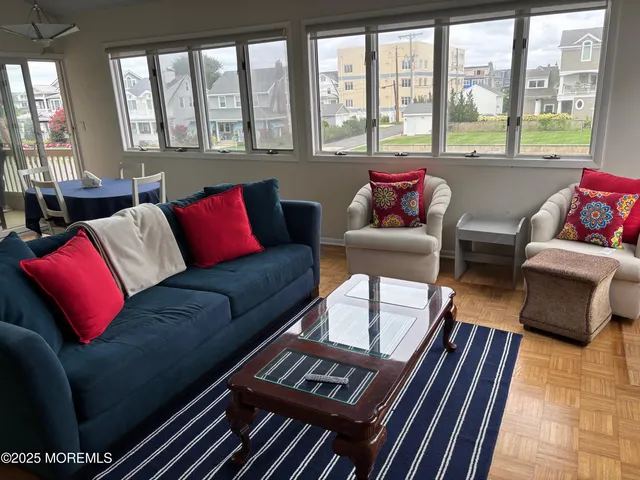 a view of a dining room with furniture and windows