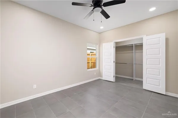 an empty room with a empty space and windows